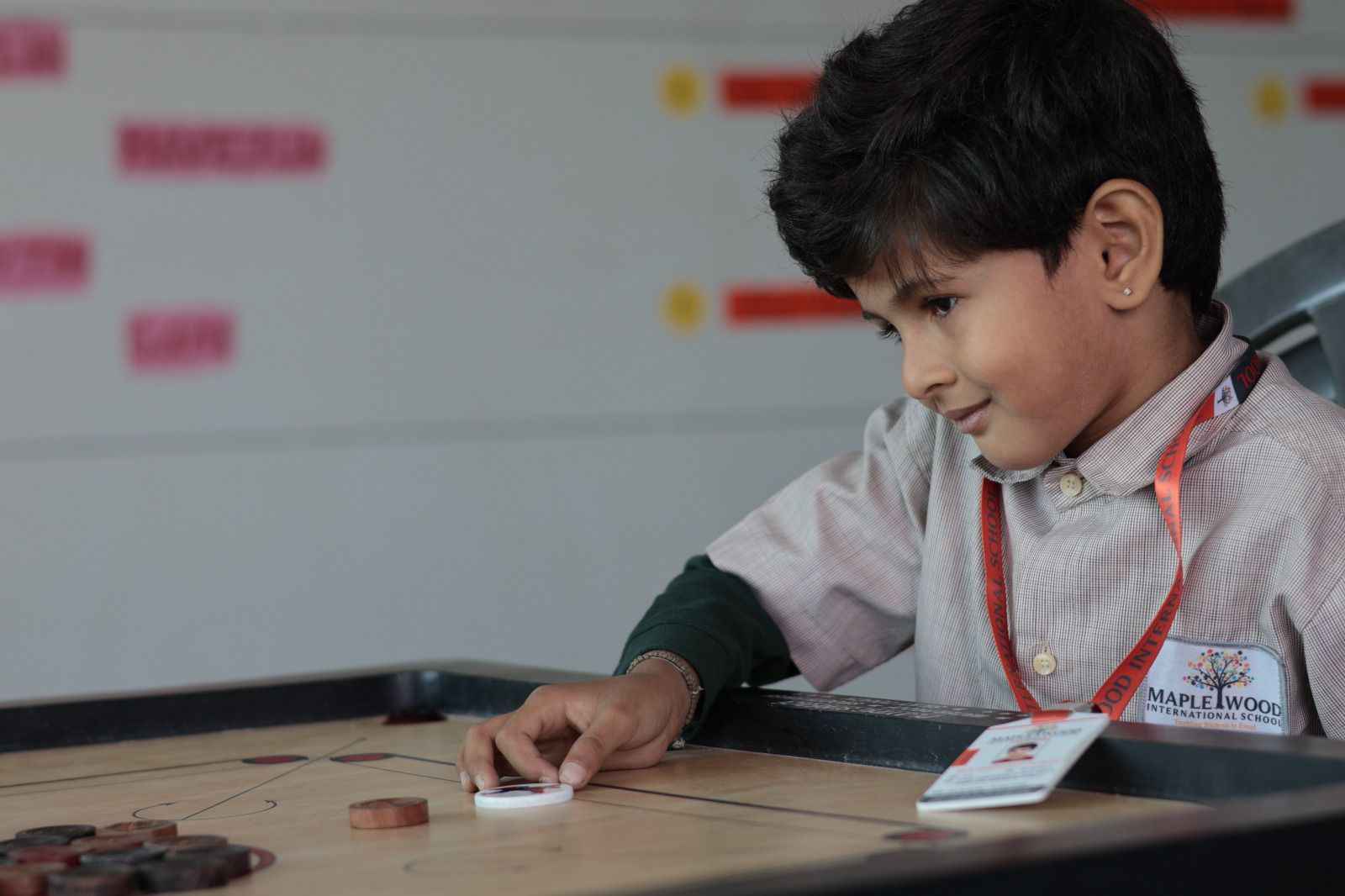 child playing carrom